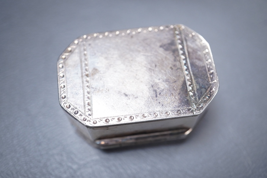 A George III silver octagonal nutmeg grater by Phipps & Robinson, London, 1810, 46mm(a.f.), together with a George III silver pedestal pepperette, by Alice & George Burroughs, London, 1808, 70mm.